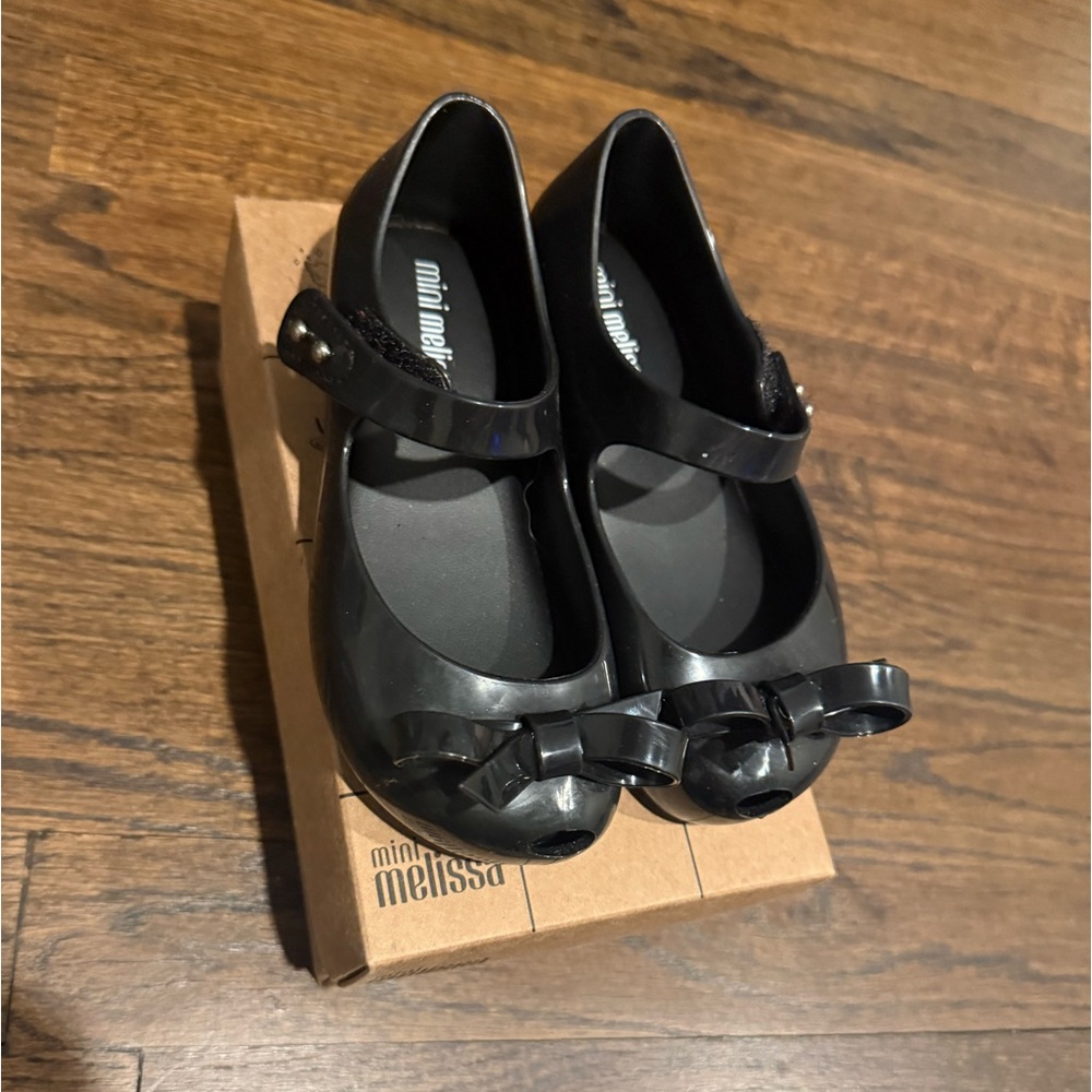 Black bow mini melissa jelly shoes! Worn once outdoors!